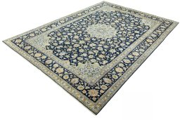 Corner detail of 2000s Kashan rug showing border pattern and Wool pile