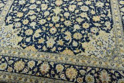 Close-up detail of 2000s Kashan rug from Iran / Persia showing Wool weave