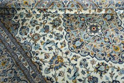 Close-up detail of 2000s Kashan rug from Iran / Persia showing Wool weave
