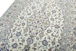 Backside of handmade 2000s Kashan rug showing knot structure and weave density