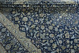 Close-up detail of 2000s Kashan rug from Iran / Persia showing Wool weave