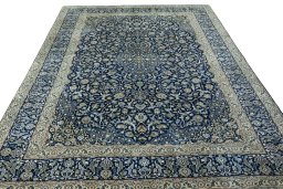 Surface texture of 2000s Kashan rug with natural Wool and intricate pattern