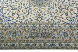 Corner detail of 2000s Kashan rug showing border pattern and Wool pile