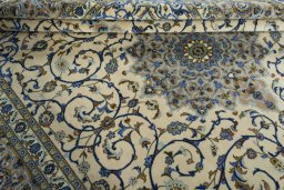 Close-up detail of 2000s Kashan rug from Iran / Persia showing Wool weave