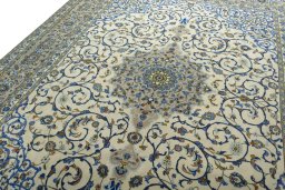 Backside of handmade 2000s Kashan rug showing knot structure and weave density