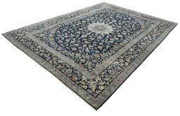 Corner detail of 2000s Kashan rug showing border pattern and Wool pile
