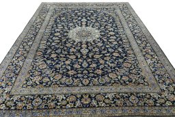 Surface texture of 2000s Kashan rug with natural Wool and intricate pattern