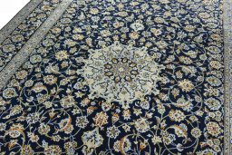 Backside of handmade 2000s Kashan rug showing knot structure and weave density