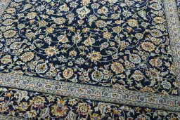 Close-up detail of 2000s Kashan rug from Iran / Persia showing Wool weave