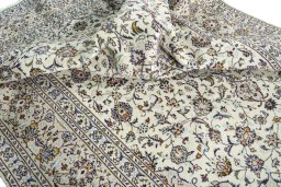 Surface texture of 2000s Kashan rug with natural Wool and intricate pattern