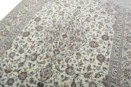 Backside of handmade 2000s Kashan rug showing knot structure and weave density