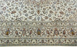 Corner detail of 2000s Kashan rug showing border pattern and Wool pile