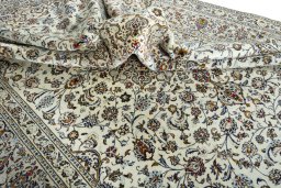 Surface texture of 2000s Kashan rug with natural Wool and intricate pattern