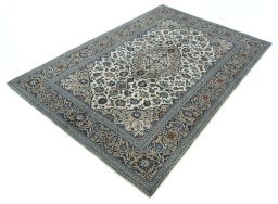 Corner detail of 2000s Kashan rug showing border pattern and Wool pile