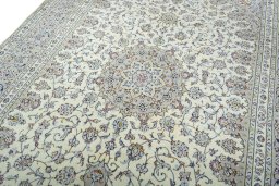 Backside of handmade 2000s Kashan rug showing knot structure and weave density