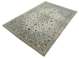 Corner detail of 2000s Kashan rug showing border pattern and Wool pile