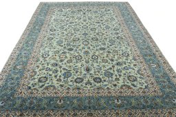 Surface texture of 2000s Kashan rug with natural Wool and intricate pattern