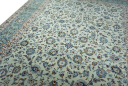 Backside of handmade 2000s Kashan rug showing knot structure and weave density