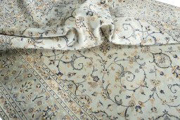 Surface texture of 2000s Kashan rug with natural Wool and intricate pattern