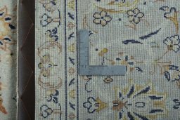 Backside of handmade 2000s Kashan rug showing knot structure and weave density