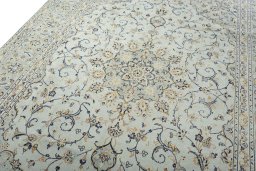Backside of handmade 2000s Kashan rug showing knot structure and weave density