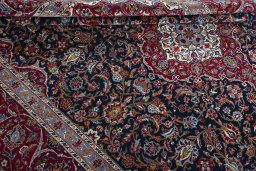 Close-up detail of 2000s Kashan rug from Iran / Persia showing Wool weave