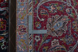 Backside of handmade 2000s Kashan rug showing knot structure and weave density