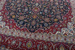 Close-up detail of 2000s Kashan rug from Iran / Persia showing Wool weave