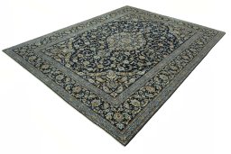 Corner detail of 2000s Kashan rug showing border pattern and Wool pile