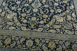 Close-up detail of 2000s Kashan rug from Iran / Persia showing Wool weave