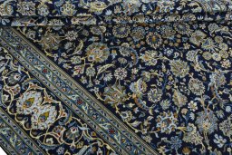 Close-up detail of 2000s Kashan rug from Iran / Persia showing Wool weave
