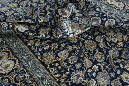 Surface texture of 2000s Kashan rug with natural Wool and intricate pattern