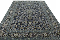 Surface texture of 2000s Kashan rug with natural Wool and intricate pattern