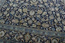 Close-up detail of 2000s Kashan rug from Iran / Persia showing Wool weave