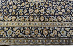 Corner detail of 1970s Kashan rug showing border pattern and Wool pile