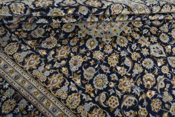Close-up detail of 1970s Kashan rug from Iran / Persia showing Wool weave