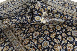 Surface texture of 1970s Kashan rug with natural Wool and intricate pattern