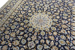 Backside of handmade 1970s Kashan rug showing knot structure and weave density