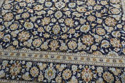 Close-up detail of 1970s Kashan rug from Iran / Persia showing Wool weave