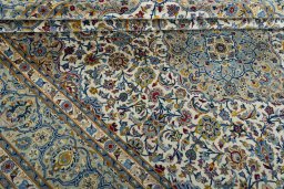 Close-up detail of 2000s Kashan rug from Iran / Persia showing Wool weave