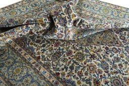 Surface texture of 2000s Kashan rug with natural Wool and intricate pattern