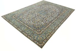 Corner detail of 2000s Kashan rug showing border pattern and Wool pile
