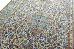 Backside of handmade 2000s Kashan rug showing knot structure and weave density