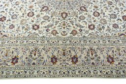 Corner detail of 2000s Kashan rug showing border pattern and Wool pile