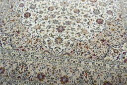 Close-up detail of 2000s Kashan rug from Iran / Persia showing Wool weave