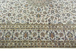 Corner detail of 2000s Kashan rug showing border pattern and Wool pile