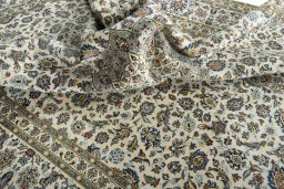 Surface texture of 2000s Kashan rug with natural Wool and intricate pattern