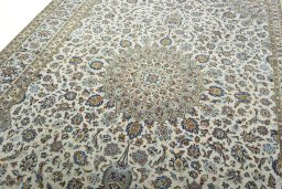 Backside of handmade 2000s Kashan rug showing knot structure and weave density