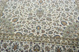 Close-up detail of 2000s Kashan rug from Iran / Persia showing Wool weave