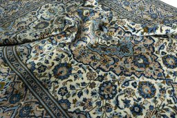 Surface texture of 2000s Kashan rug with natural Wool and intricate pattern